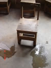 Rainwater puddles and broken furniture